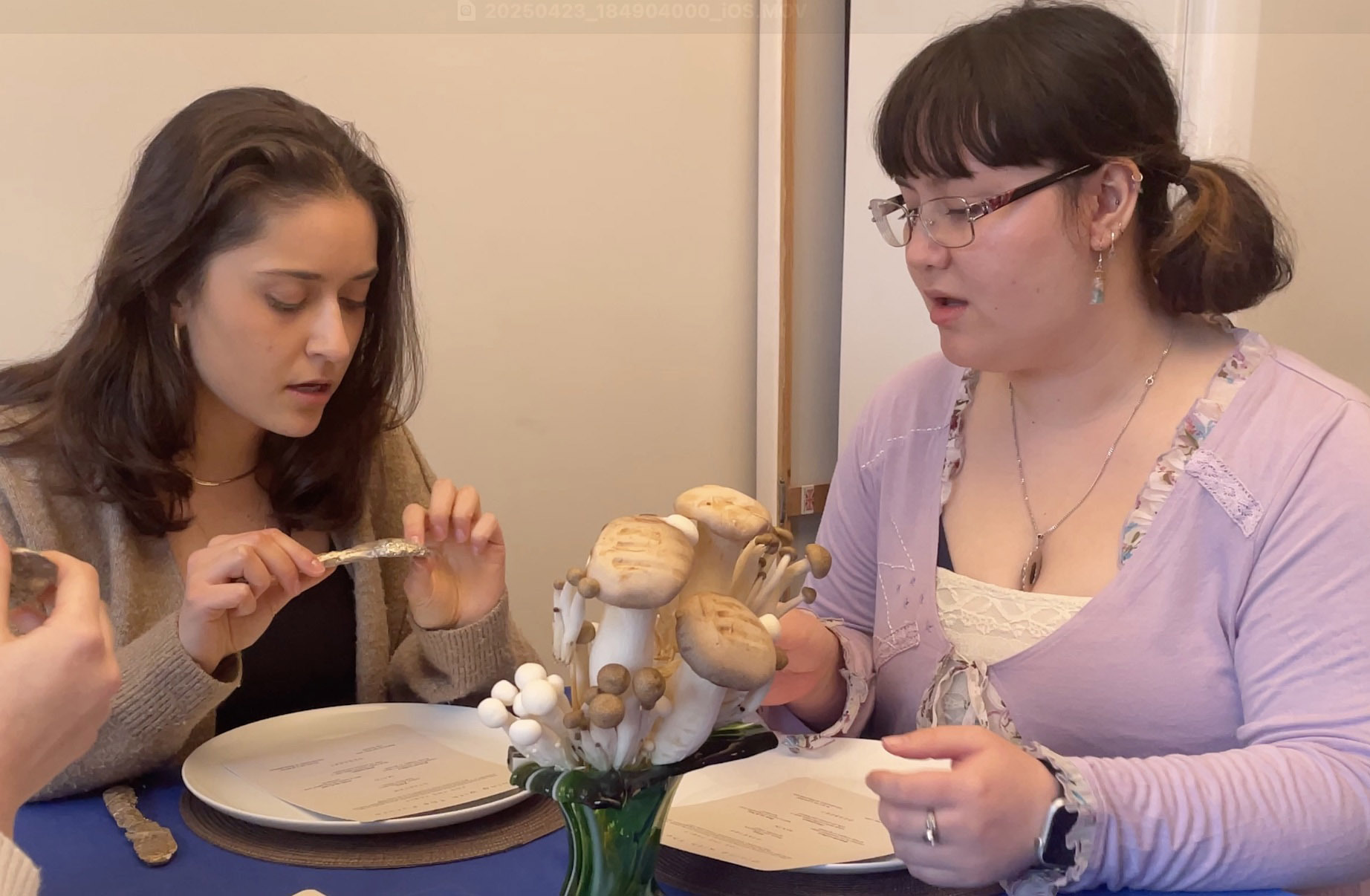 2 people at a table feeling casted cutlery