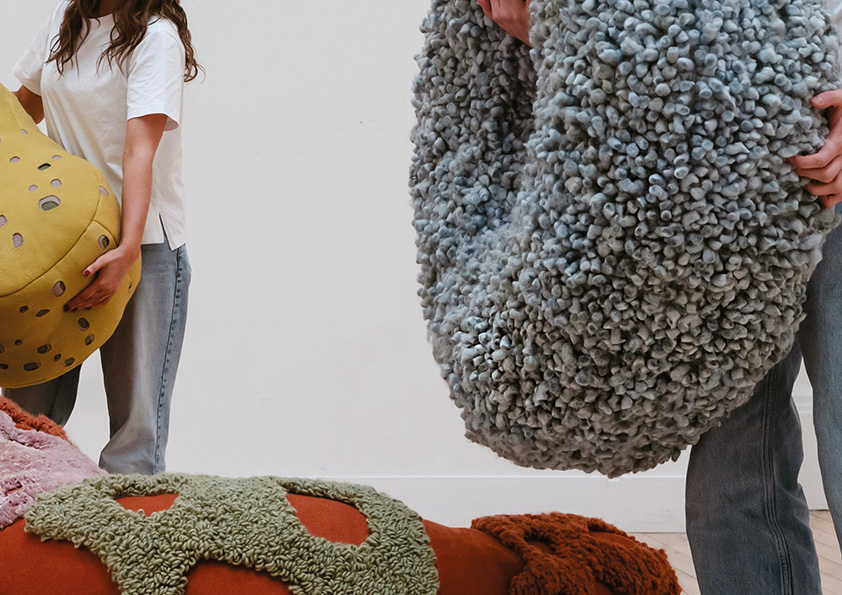 Two people holding texture shapes