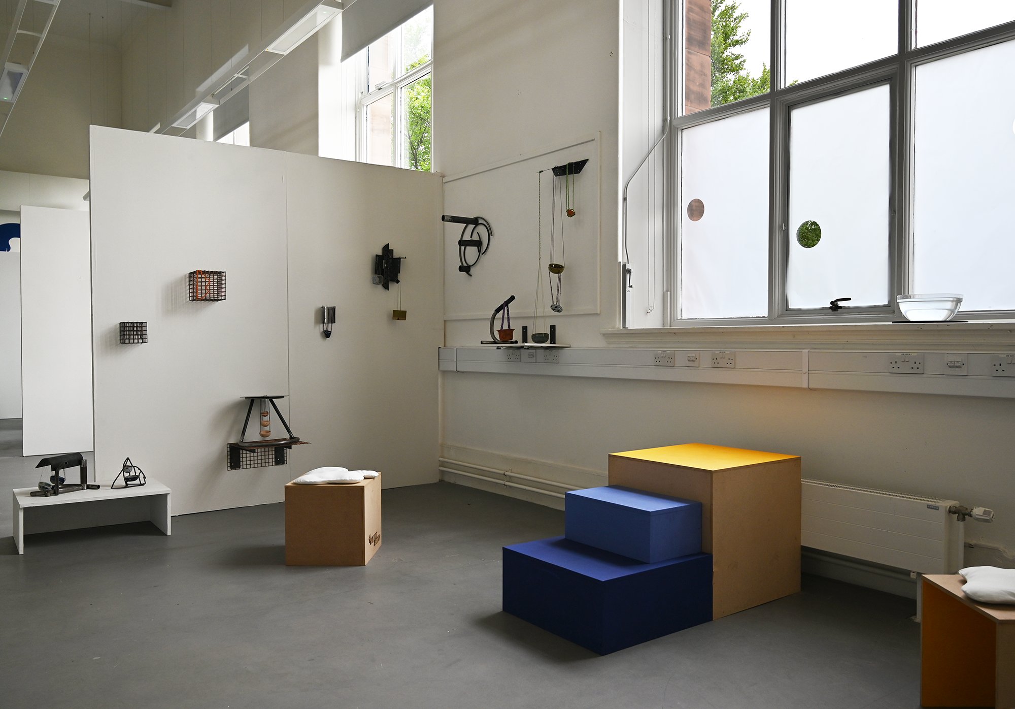 Exhibition space, featuring Lucie's sculptures, my installation '... (dot dot dot)', and the movable stalls