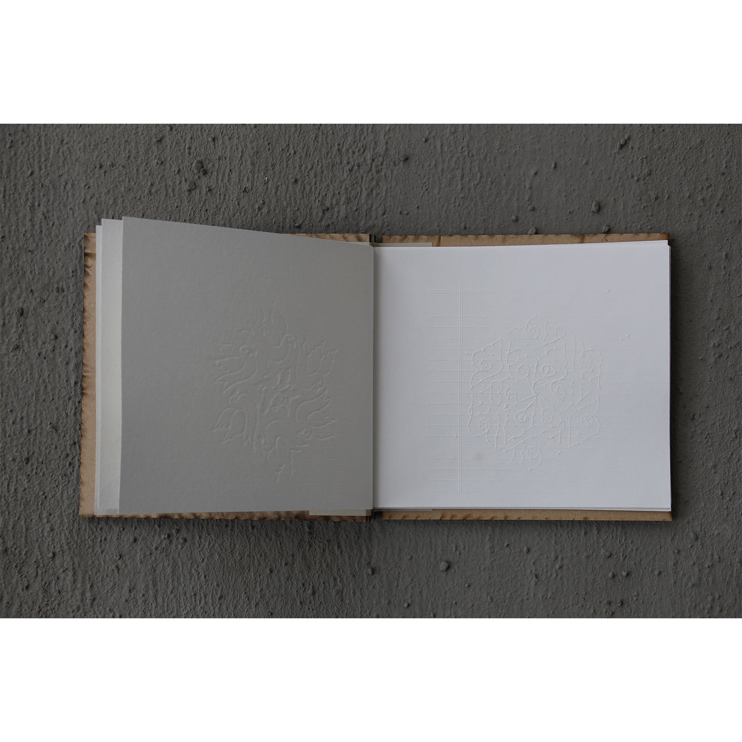     Close-up of an open book featuring embossed print