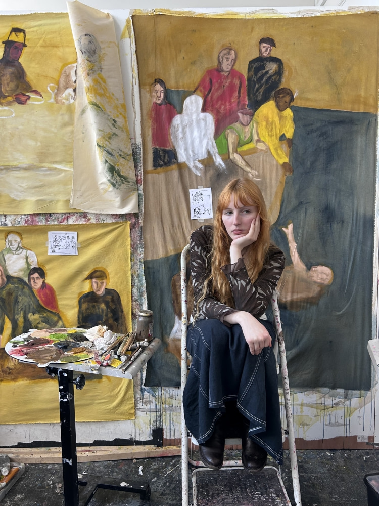 Photo of the artist in their studio