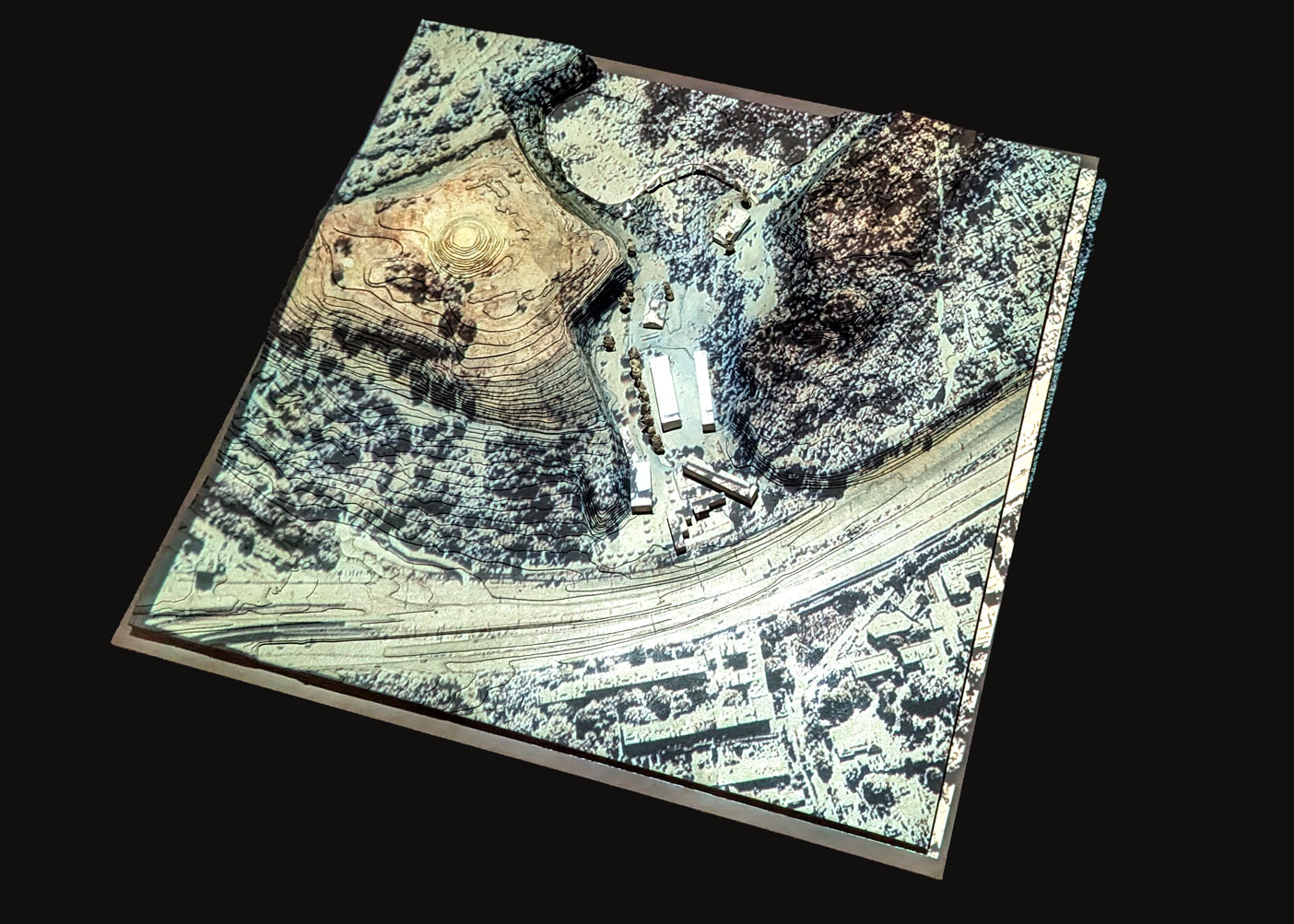 Topographical model of site 1, the boundary of KL Plaszow, including existing buildings, proposed structures and planted poplar trees, and a projection of vegetation.