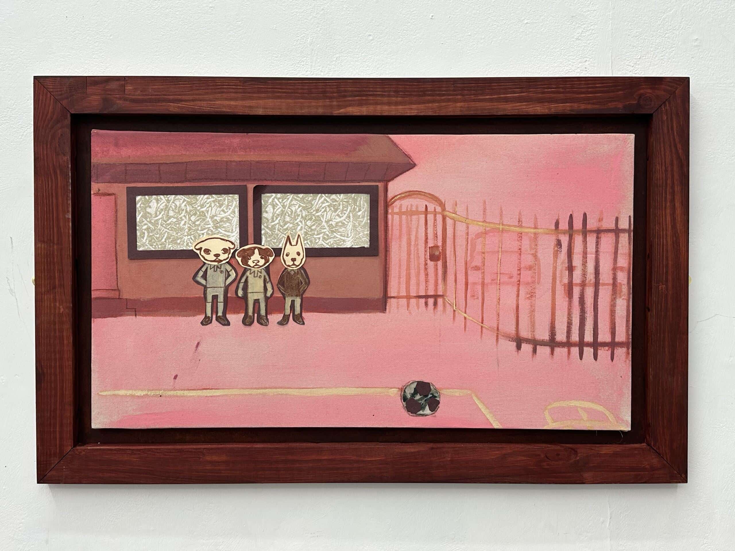 Three dogs stood by a wall in a school playground