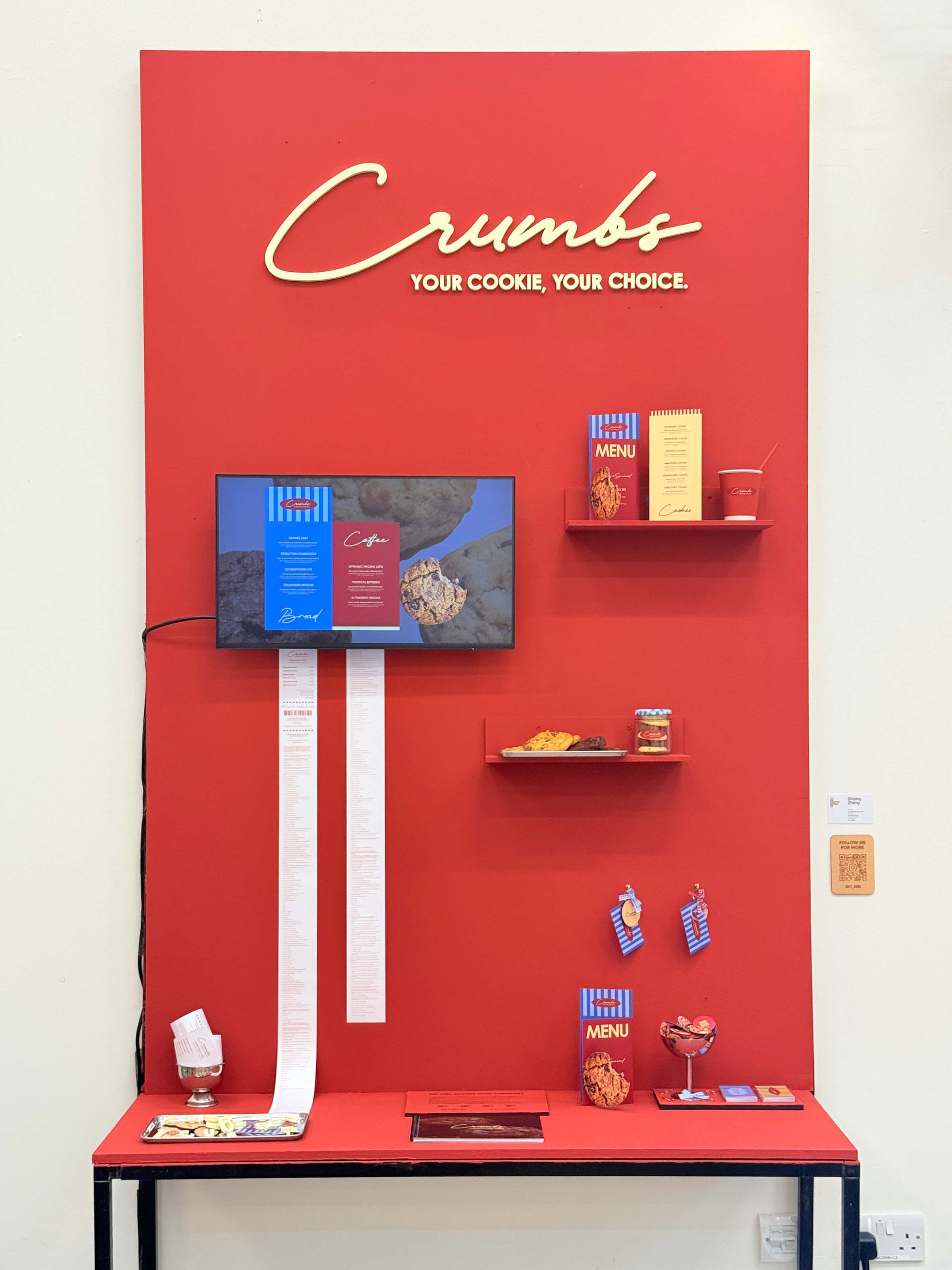 A red display stand featuring brand materials.