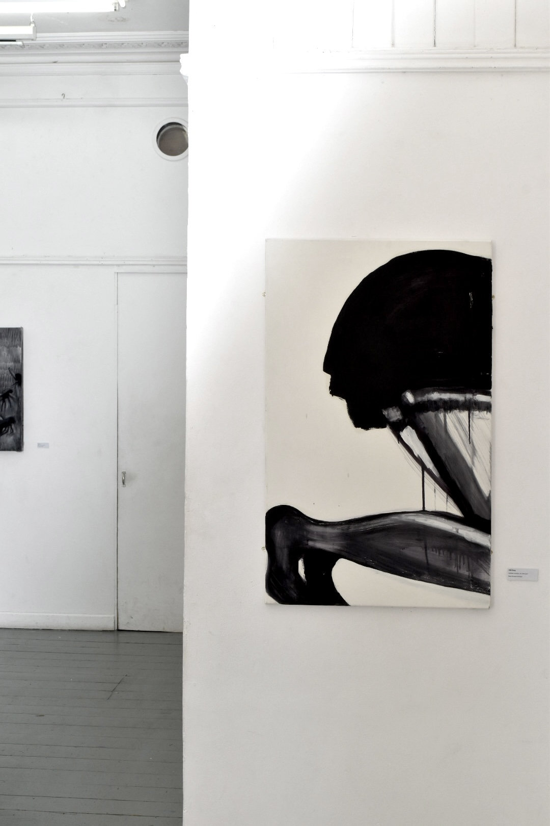 a painting of a crawling woman with only her behind in the painting