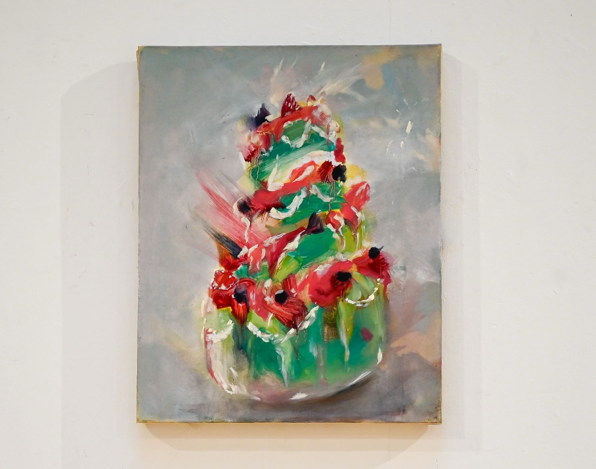 Painting of a green and pink cake on canvas