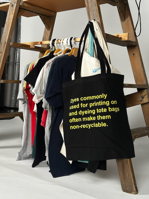 Tote bags displayed on The Museum of Overconsumption