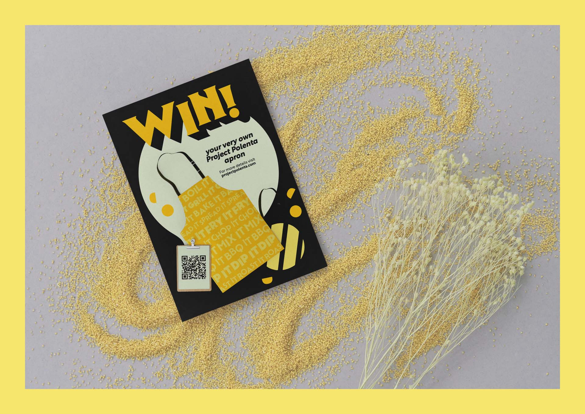 Leaflet about winning a Project Polenta branded apron on plain surface with polenta powder scattered around.