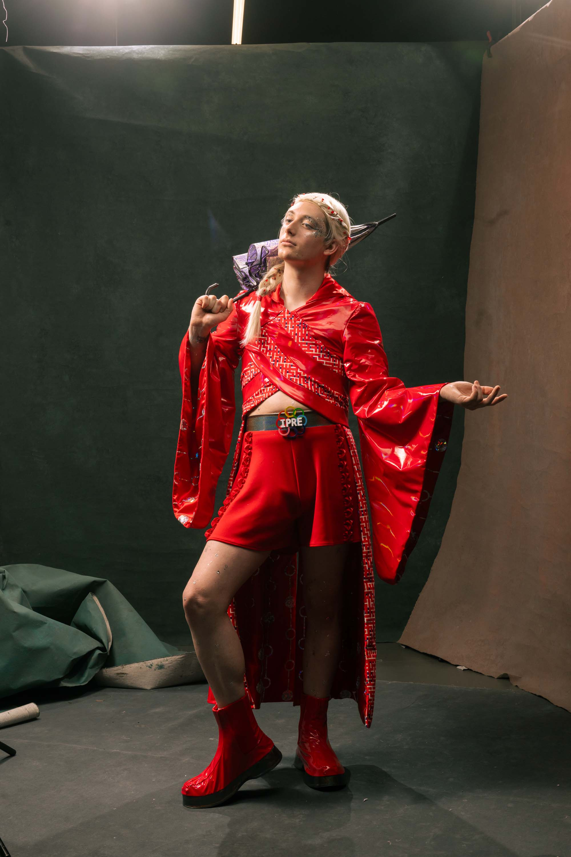 Lup posing with the umbrella behind her head