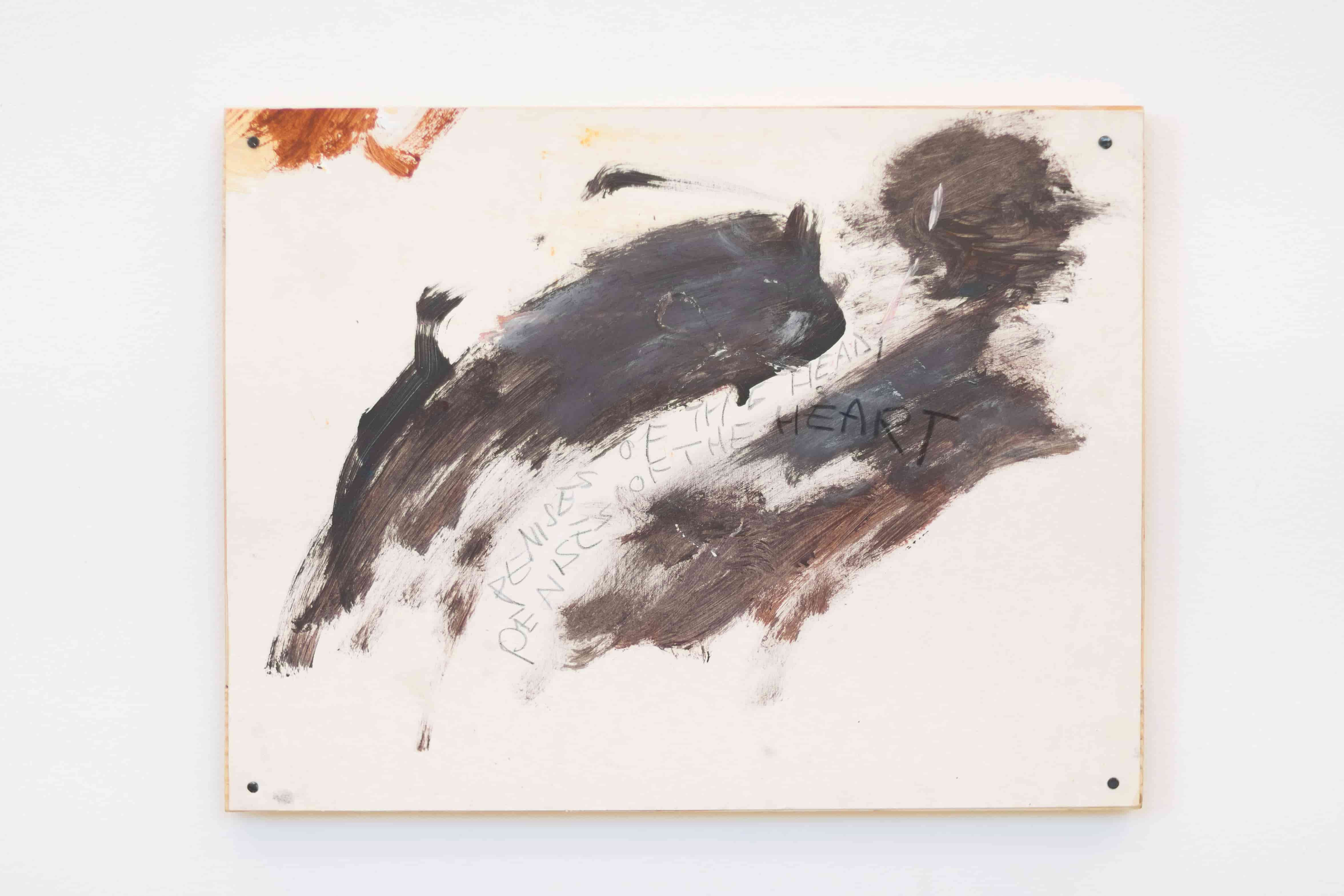 A small painting of two dark abstract figures, mounted on wood. Writing on the painting reads 'Penises of the Head, Penises of the Heart'