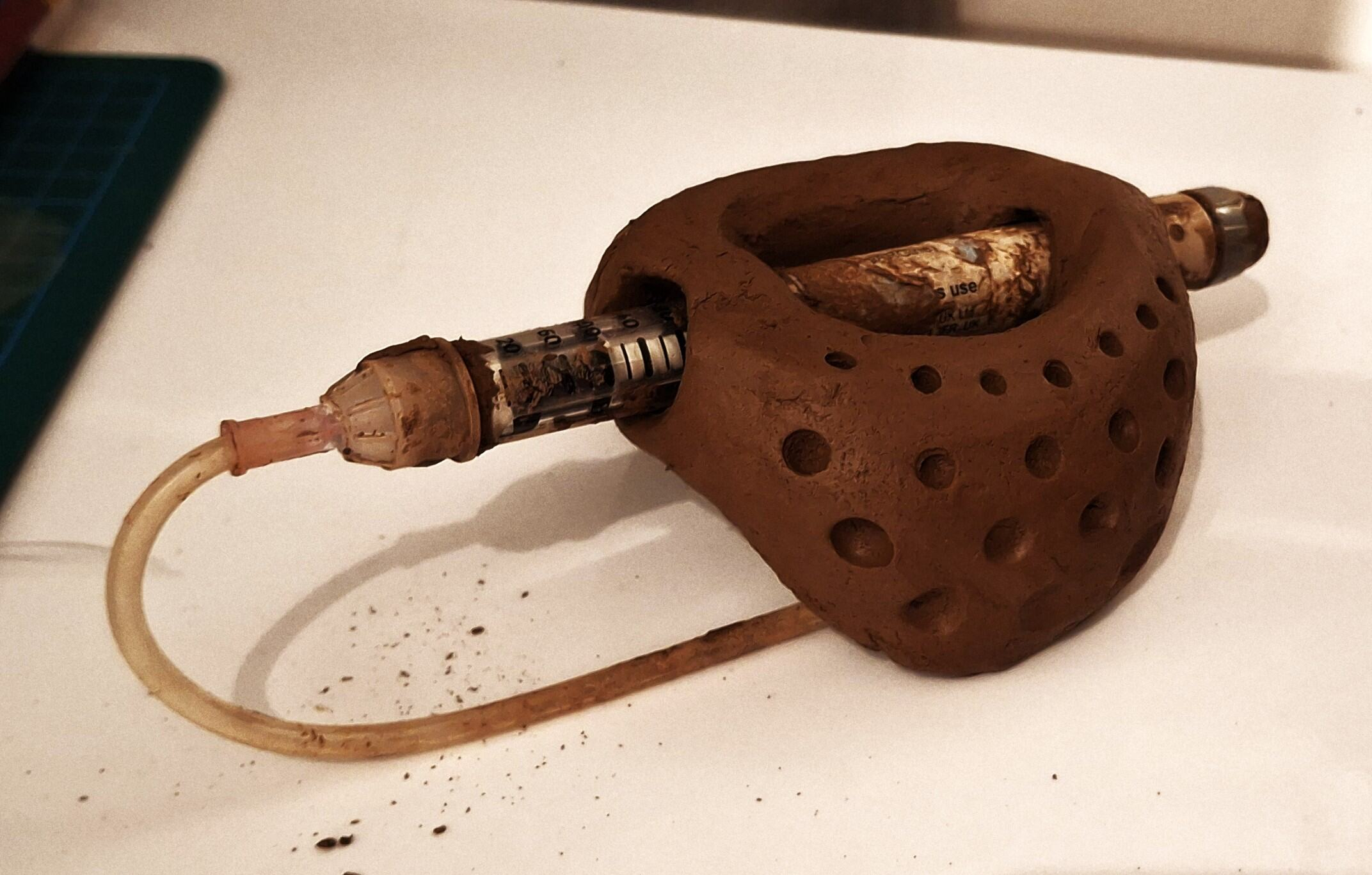 Developing the form of the injector through clay.