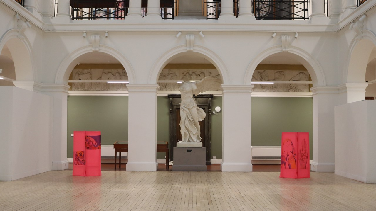 Fabric frames standing upright in the neoclassical sculpture court