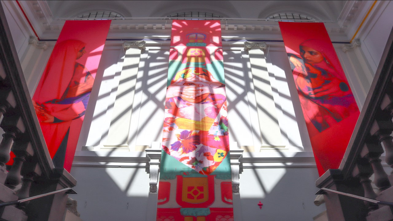 Looking up towards the banners from the stairs, with the shadow cast upon the banners.