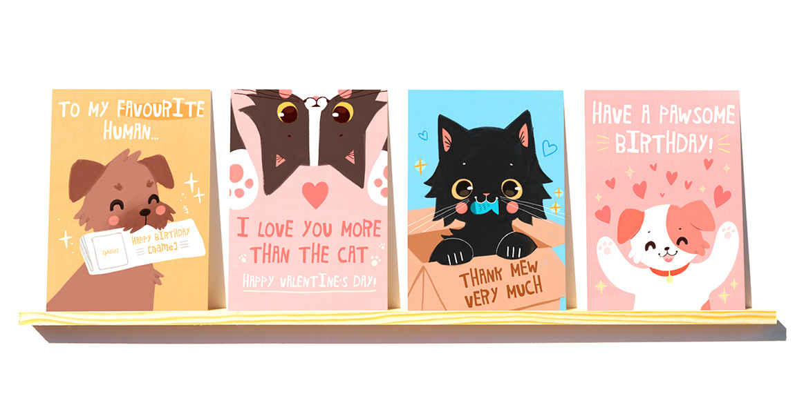 A shelf with 4 cards sitting on it, a graphic, bright style of cute characterised dogs and cats