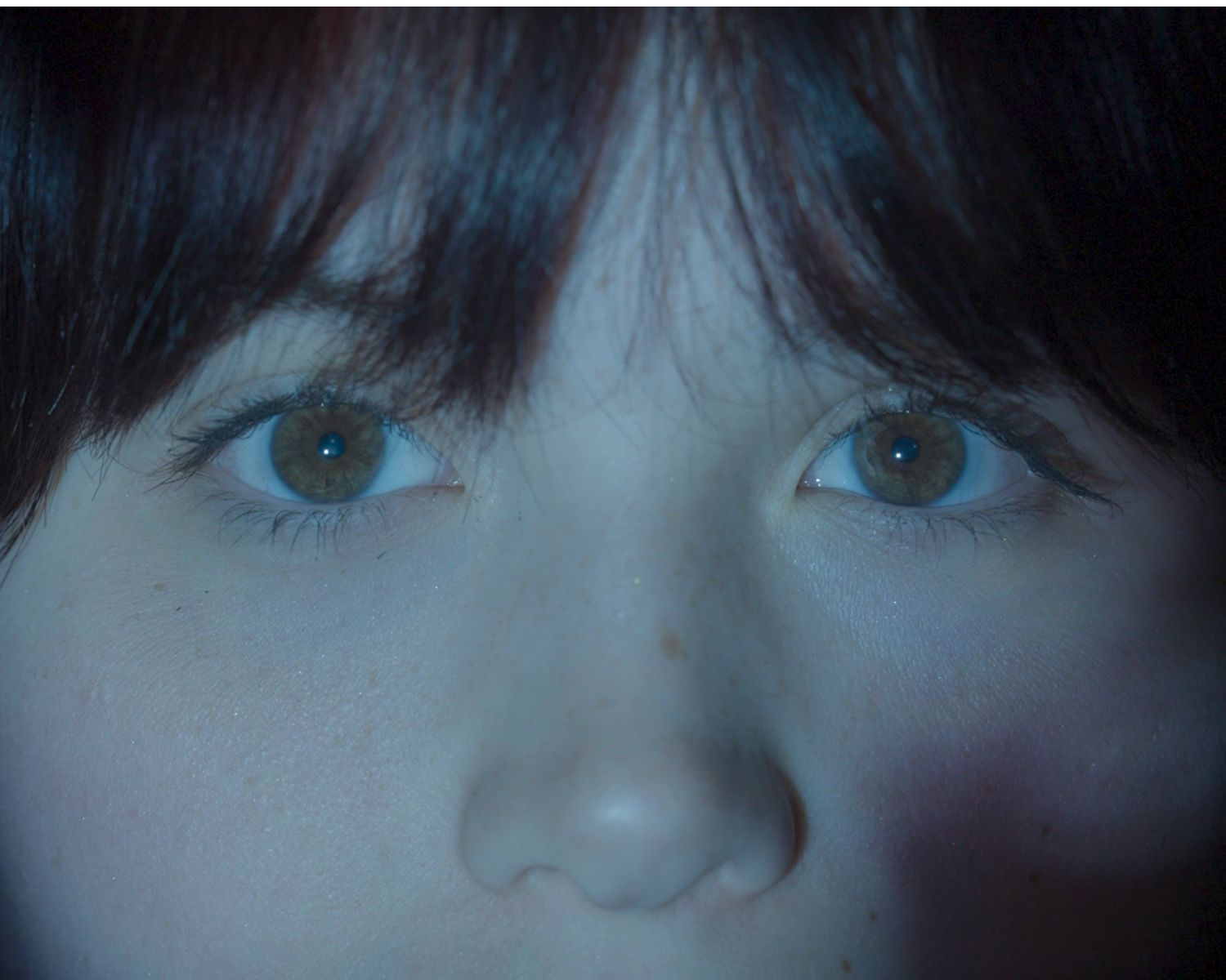 Close up of projection on my eyes still from documentary