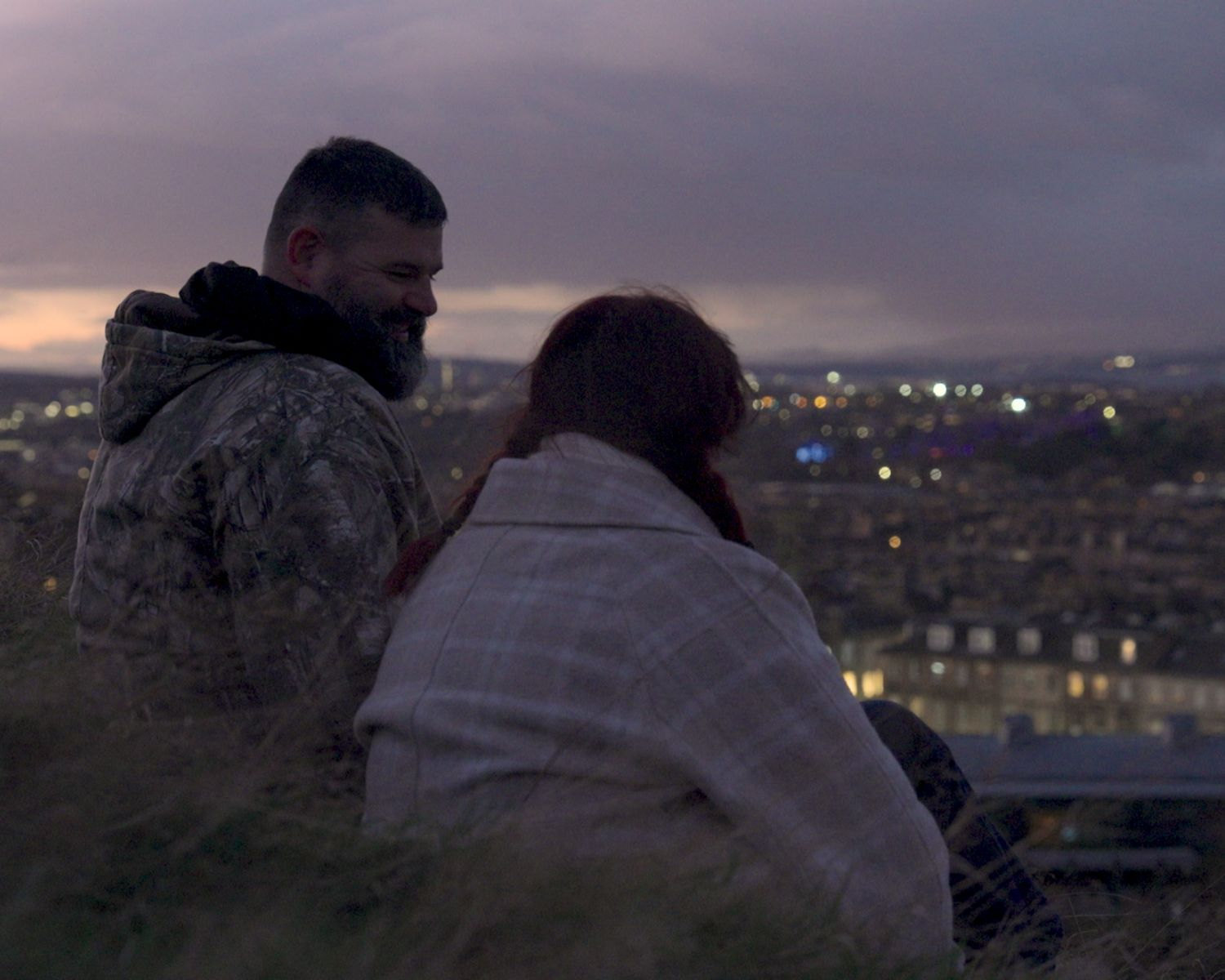 Still from the film of my dad and I sitting on Calton hill