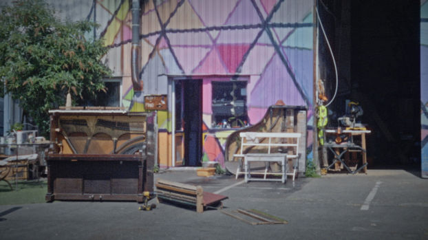 a warehouse with a piano out front