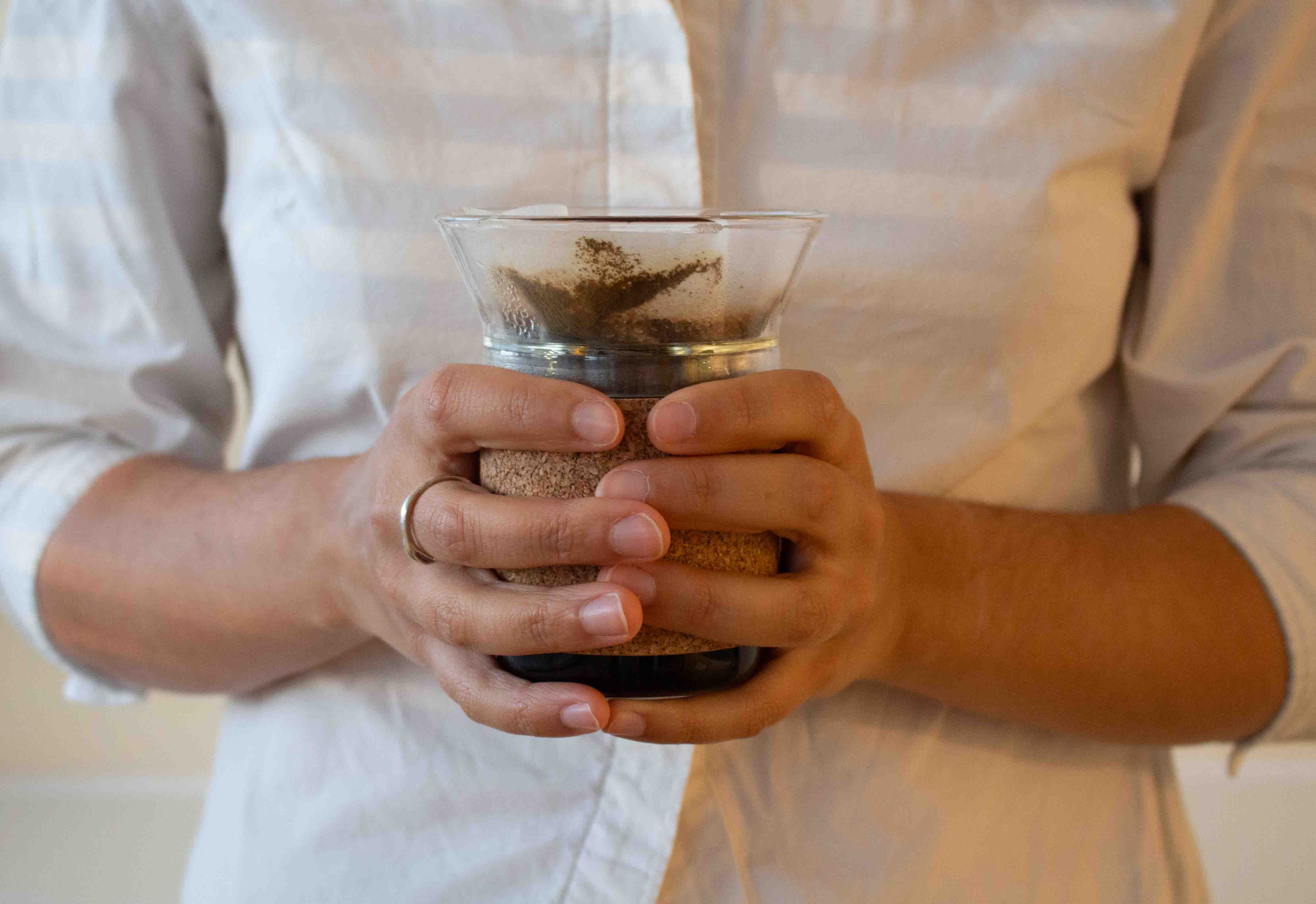 User holding the Moment dripper close to their body to feel the heat.