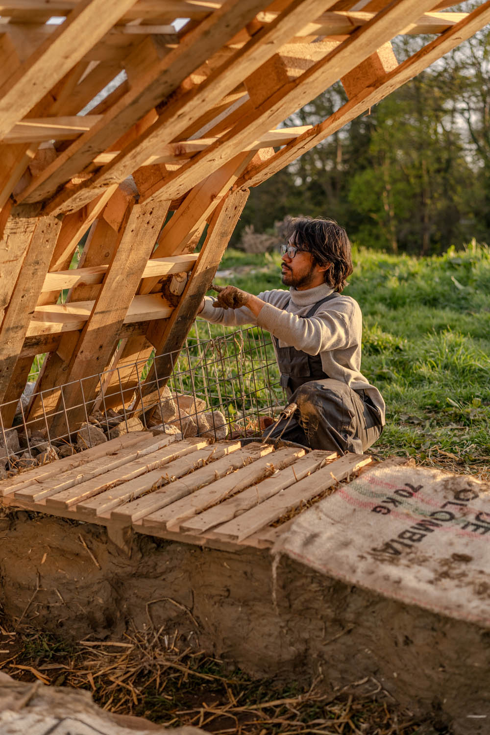 A man is seen working on the pallet arches