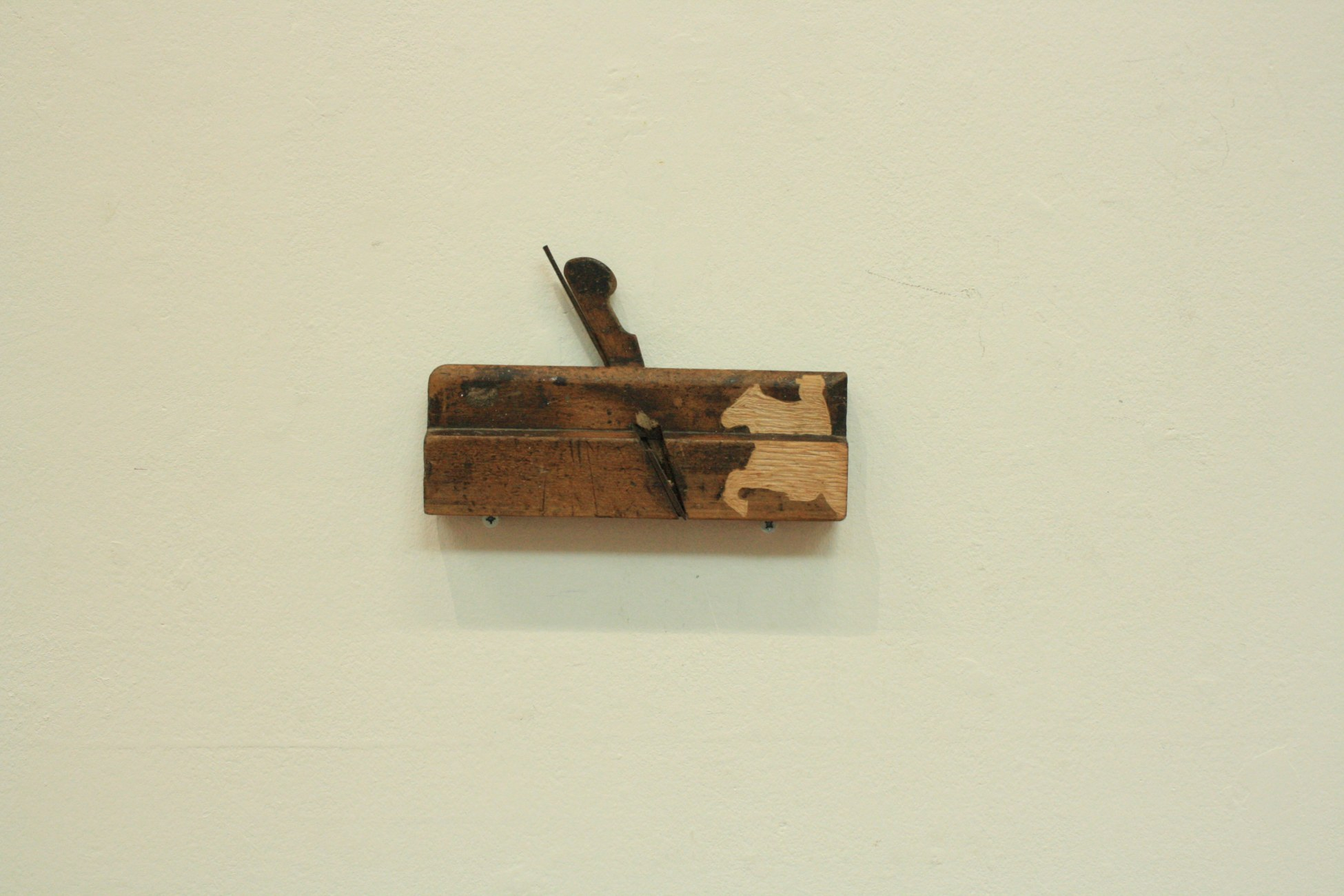 plane tool carved with cowboy figure 