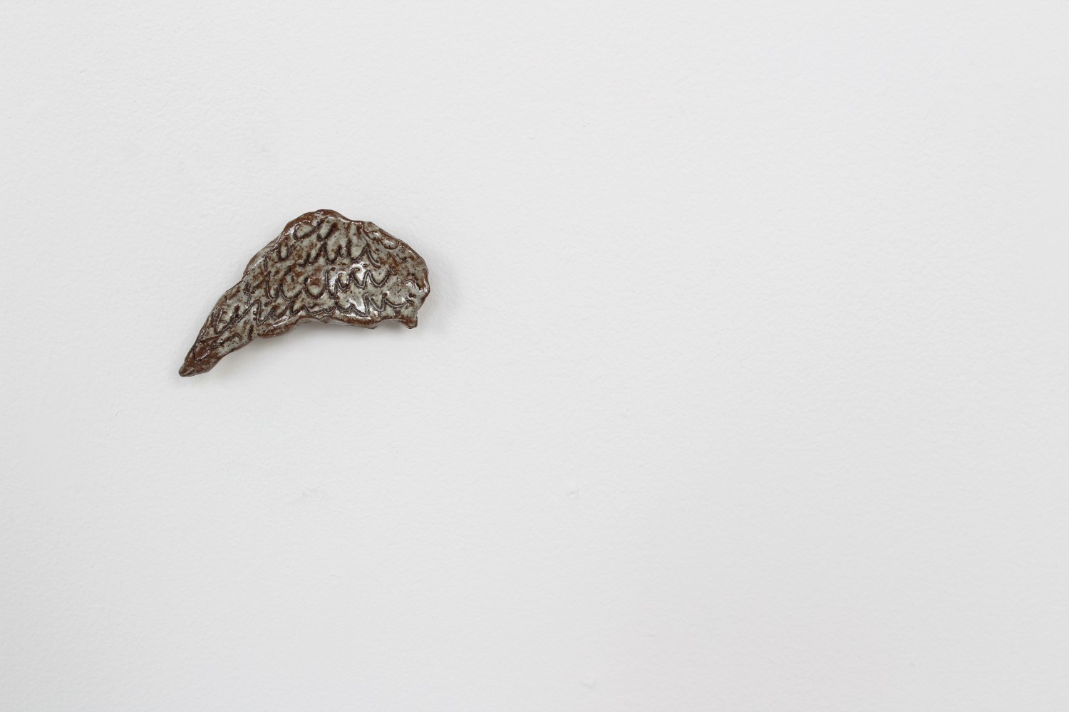 ceramic sculpture of wing