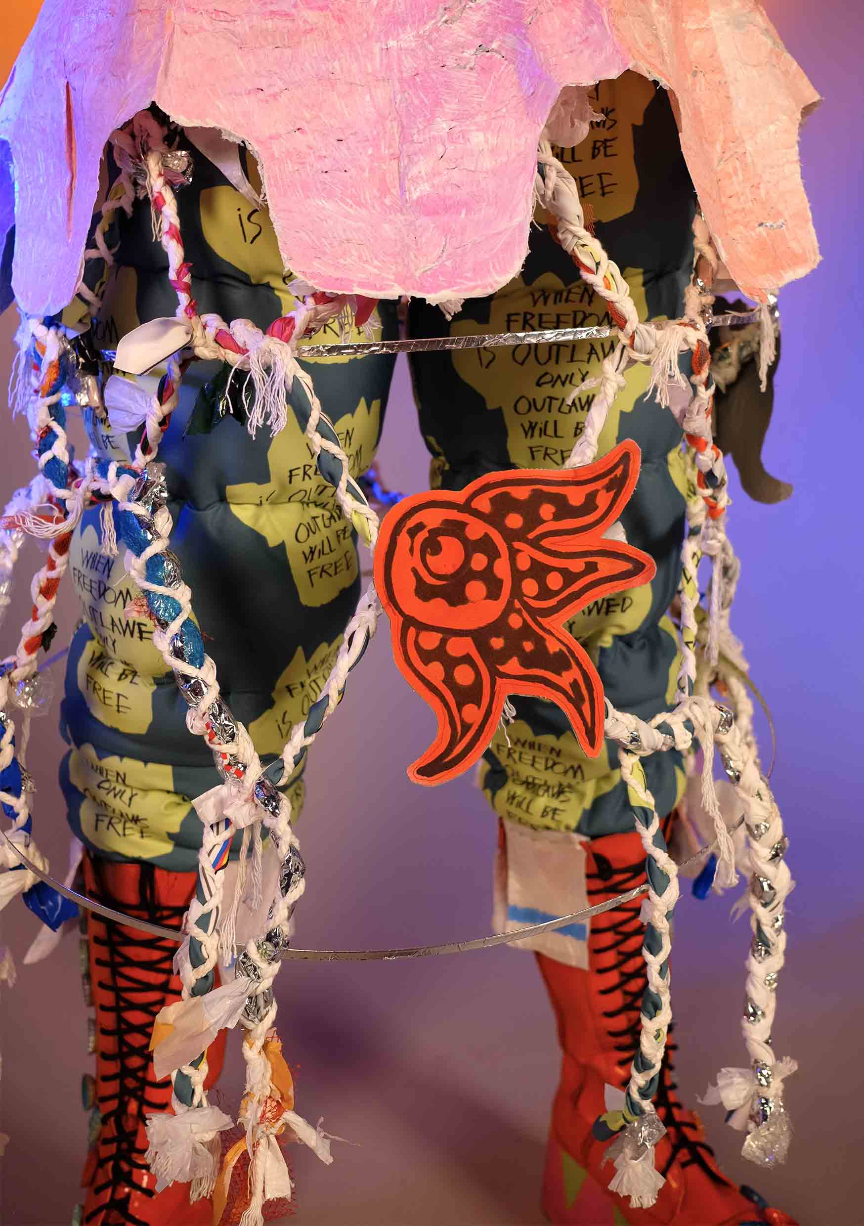 Detail of Pazuzu’s skirt with spray-painted squid motif.