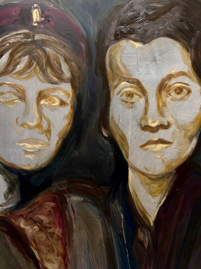 A close up of Three Figures: The woman and the girl look ahead. 