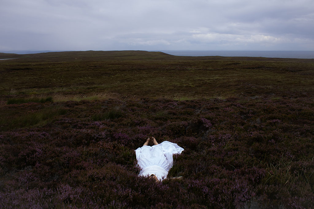 Image of woman laying down in heather