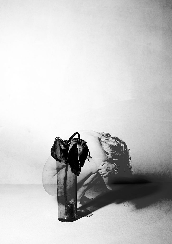 Image of woman and rose curled up 