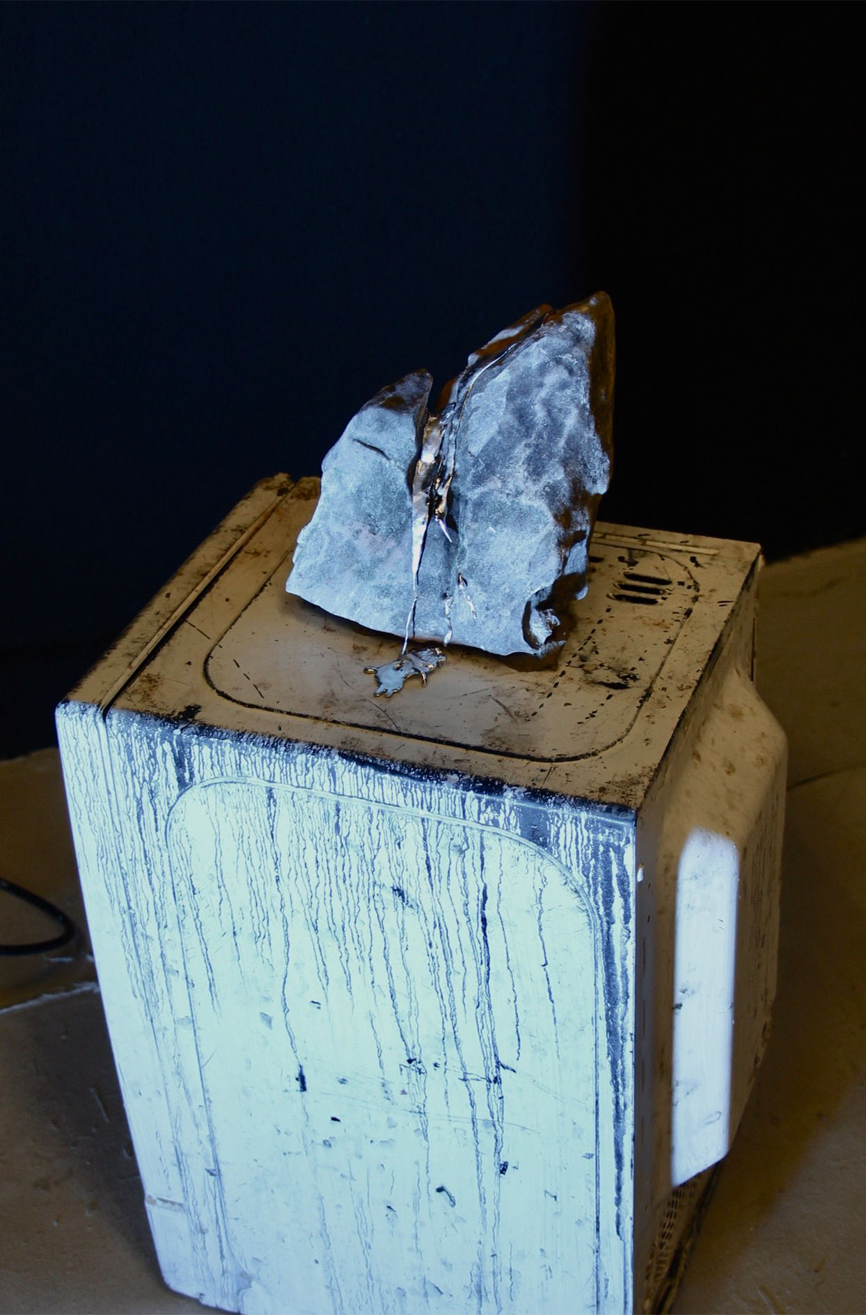 In between Mountain Tops, moving image, rock and pewter, installation, March 2026