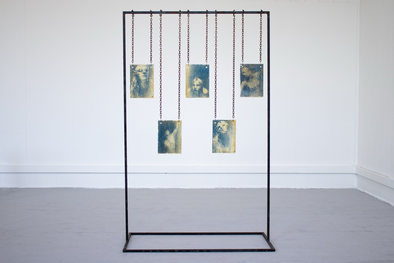 Cyanotypes on glass, suspended from metal structure
