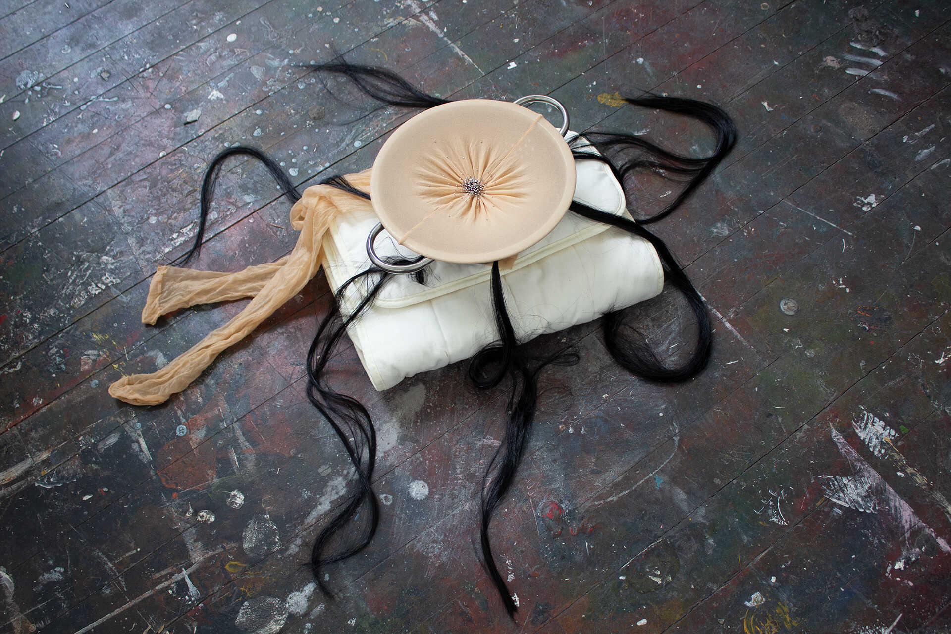 Strained, 2026 Sculpture. Pins, Nylon Tights, Hair, Cullender, 25 x 25 cm