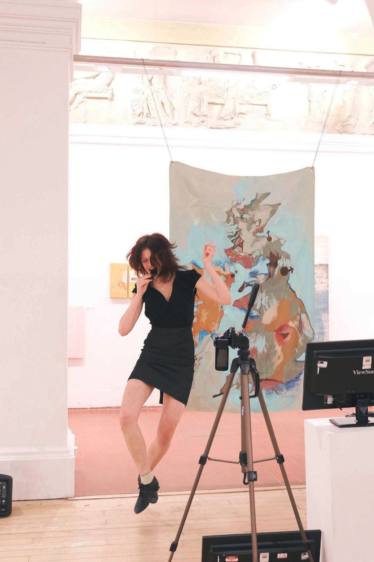 Erin is mid heel-click, performing as a tap-dancing weather forecaster.