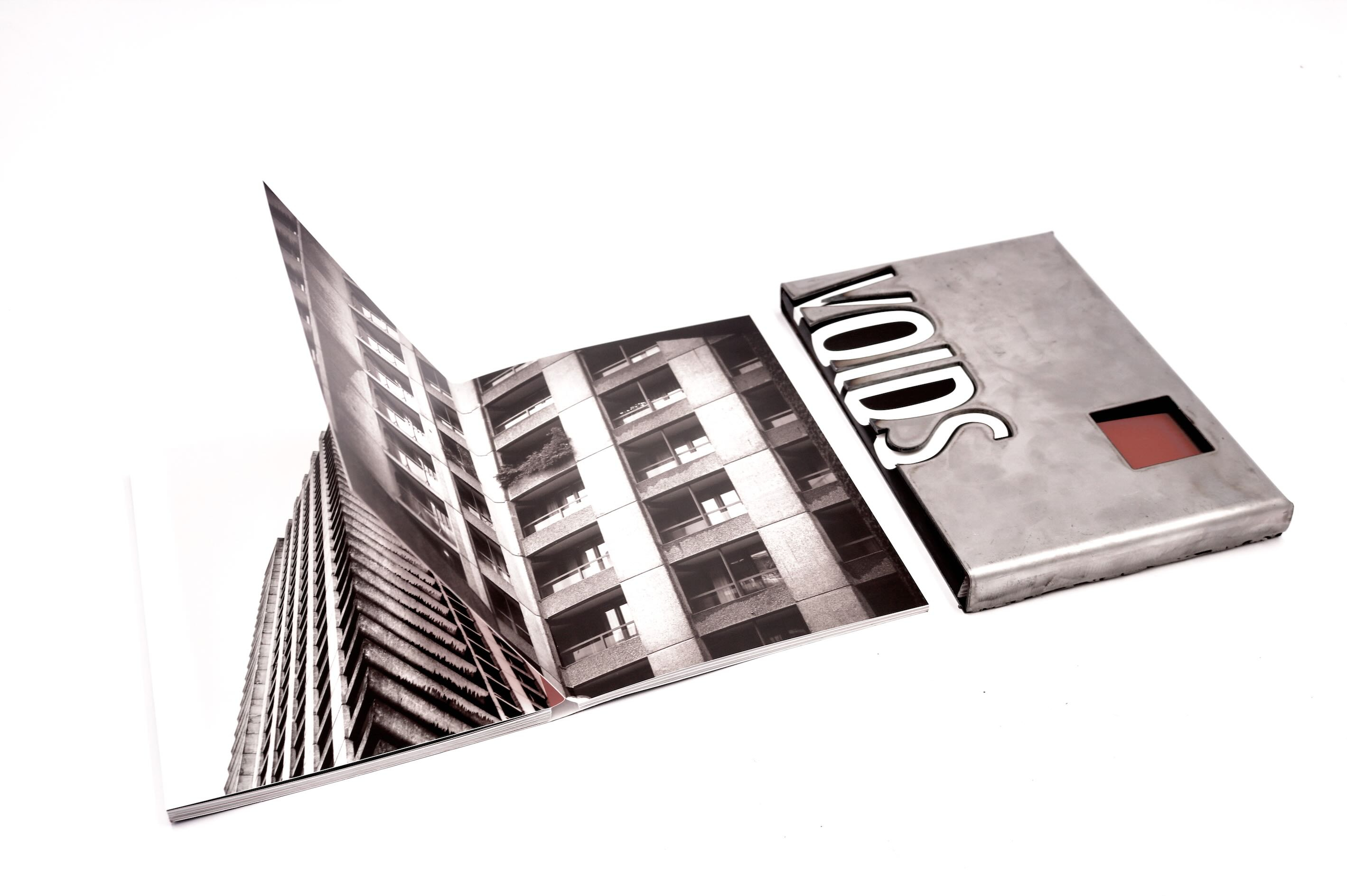 VOIDS Artists’ Book by Anna Leaver and Lily Leaver with steel slipcase, 2026. Body: Softcover, Full-colour printing, Matt Lamination, 48 pages, 200gsm Silk Cover: Full-colour printing (outside), Matt Lamination (outside), 300gsm Silk A5 (14.8 cm x 21.0 cm) portrait layflat binding with cutouts. VOIDS secondary photograph – interior and exterior
