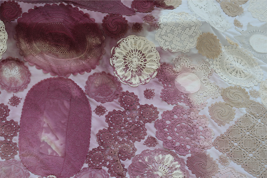 Image of crochet rug stained with red wine.