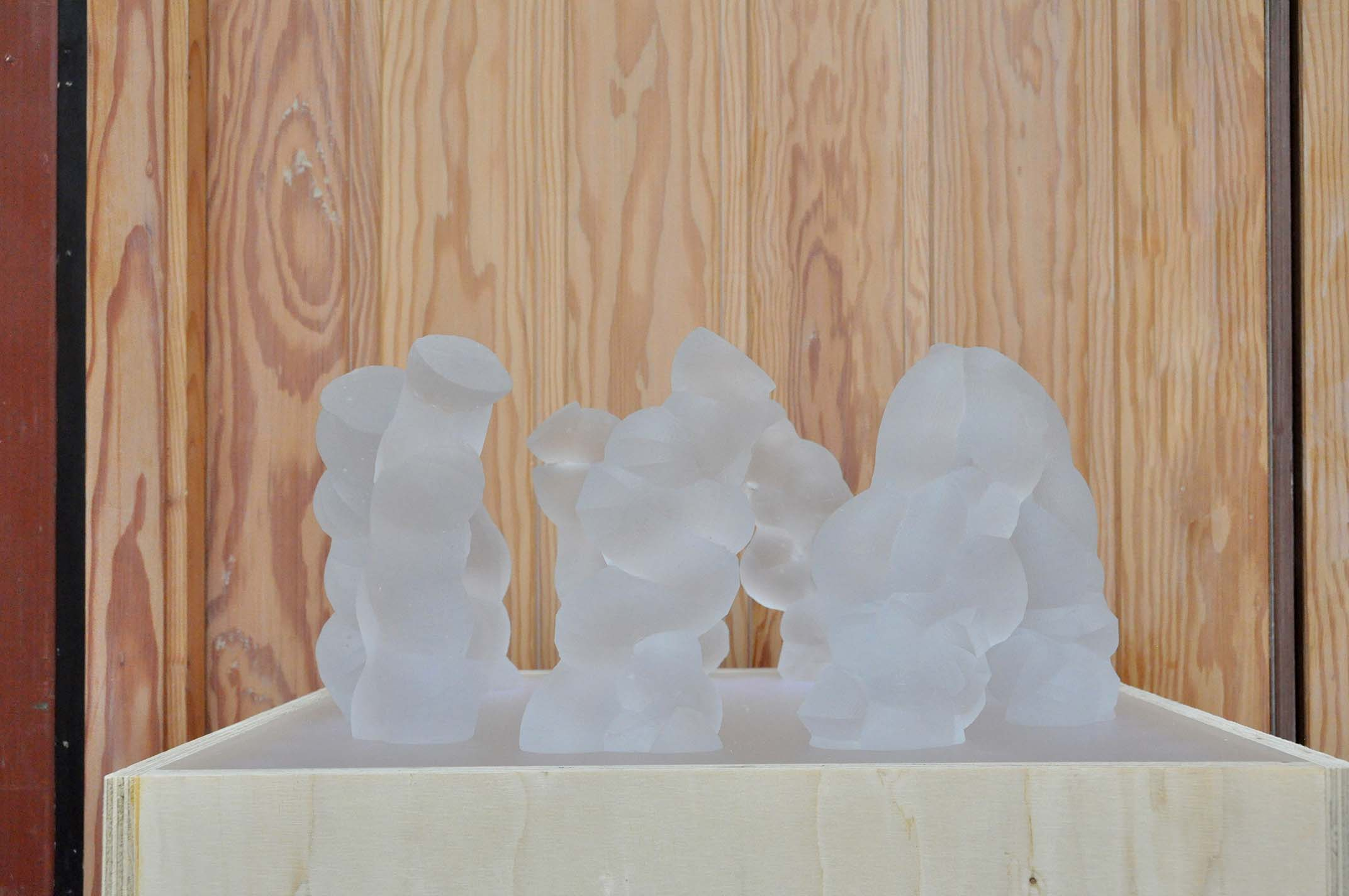 Glass sculptures on a plinth