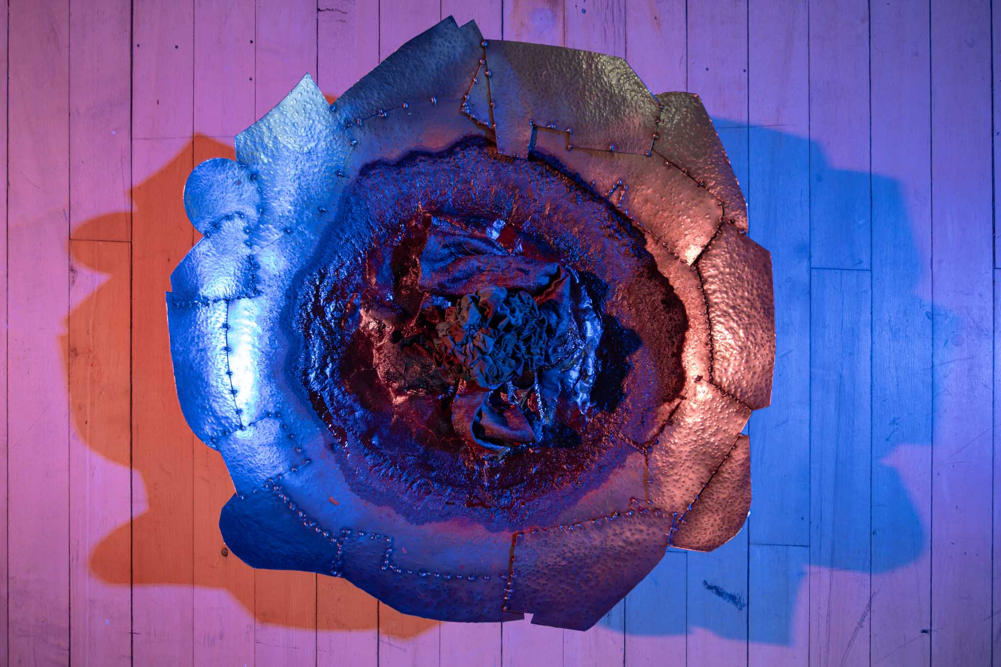 Hammered steel bowl with orange/blue shadows