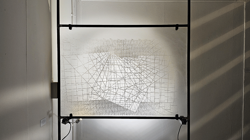 'Universal Development Framework' piece, laser etched acrylic with light shining behind it creating a lightbox effect.