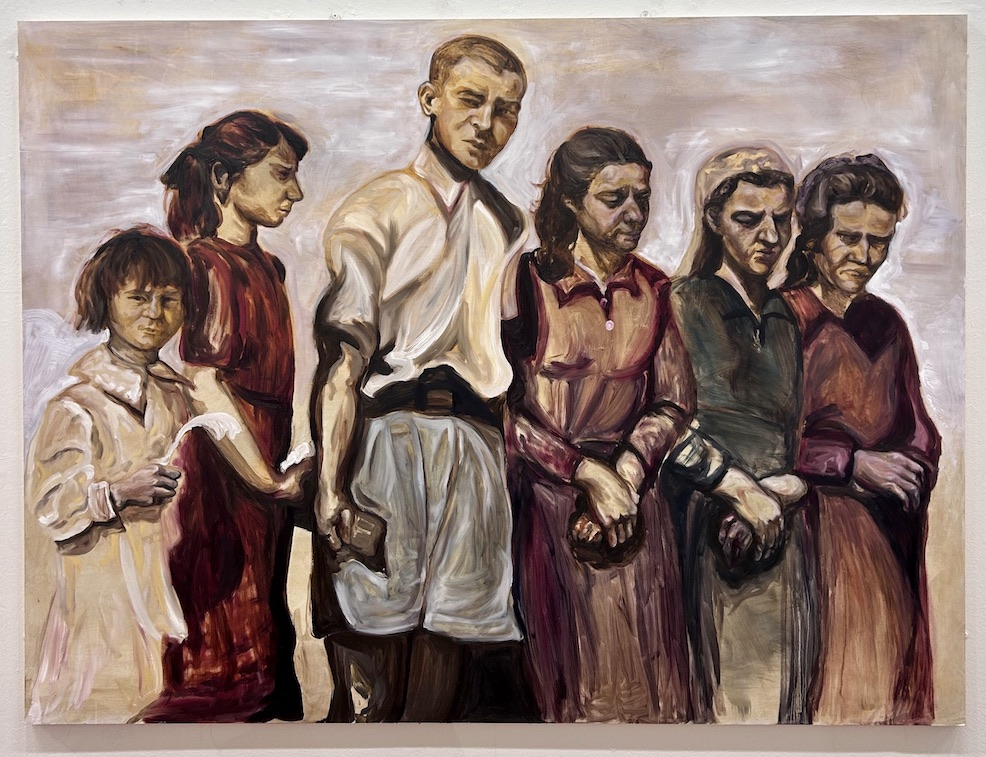 A crowd of people stand against a foggy, sandy background. The centre figure, a boy, returns the gaze of the viewer.