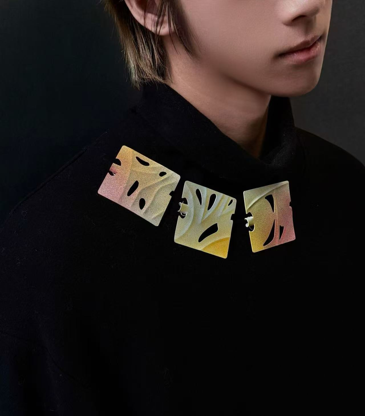 Pieces wear in a group on black cloth, become colorful accessories on black.
