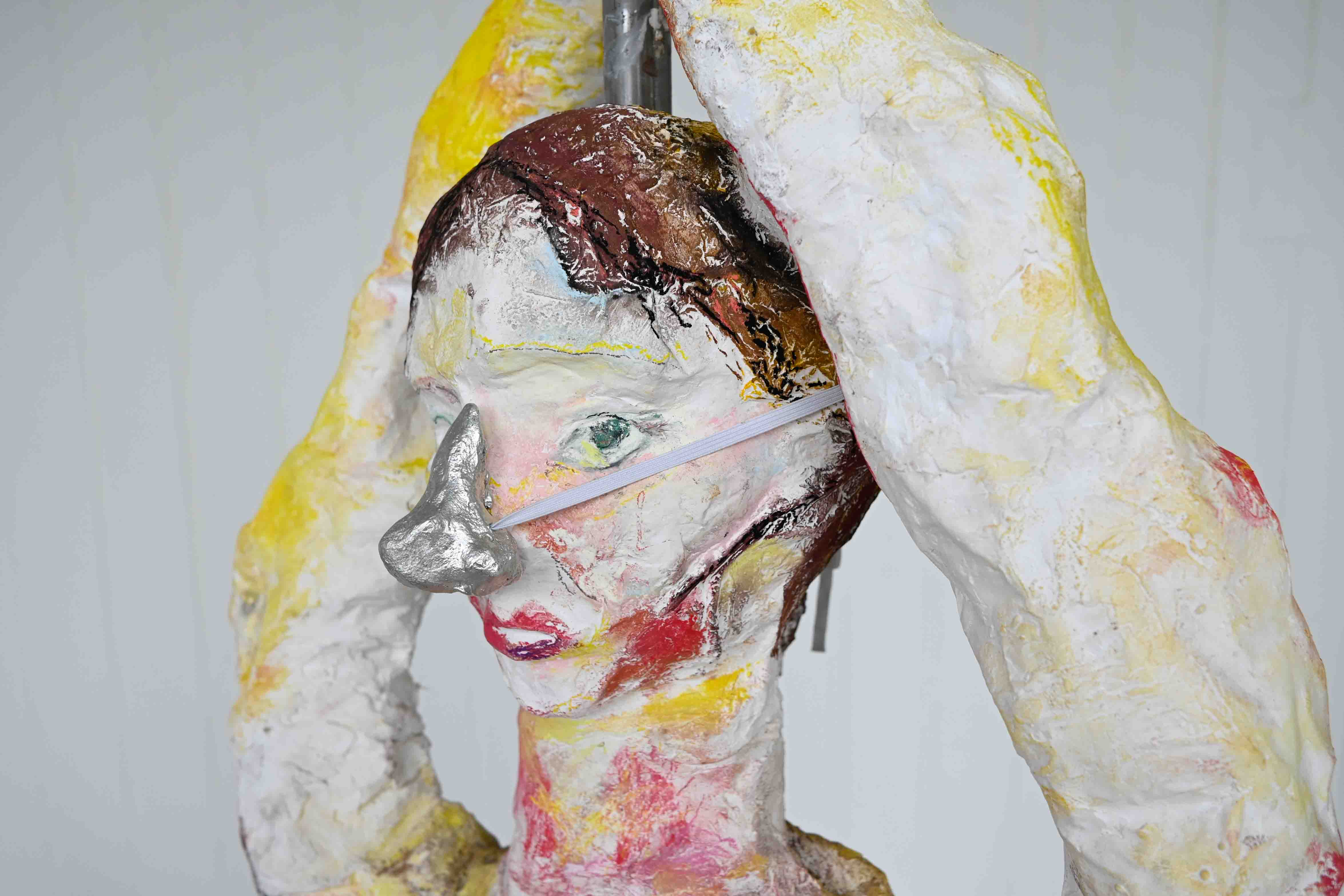 Closer view of a plaster-cast dancer.